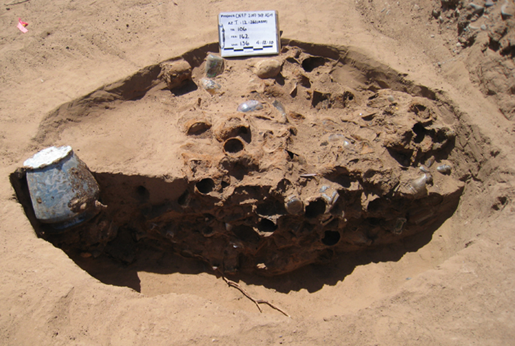 Desert Archaeology excavation and profile of a historic trash pit.
