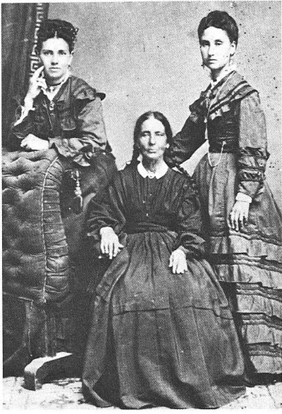 Photograph of Guadalupe Santa Cruz flanked by her nieces Atanacia Santa Cruz de Hughes and Petra Santa Cruz de Stevens.