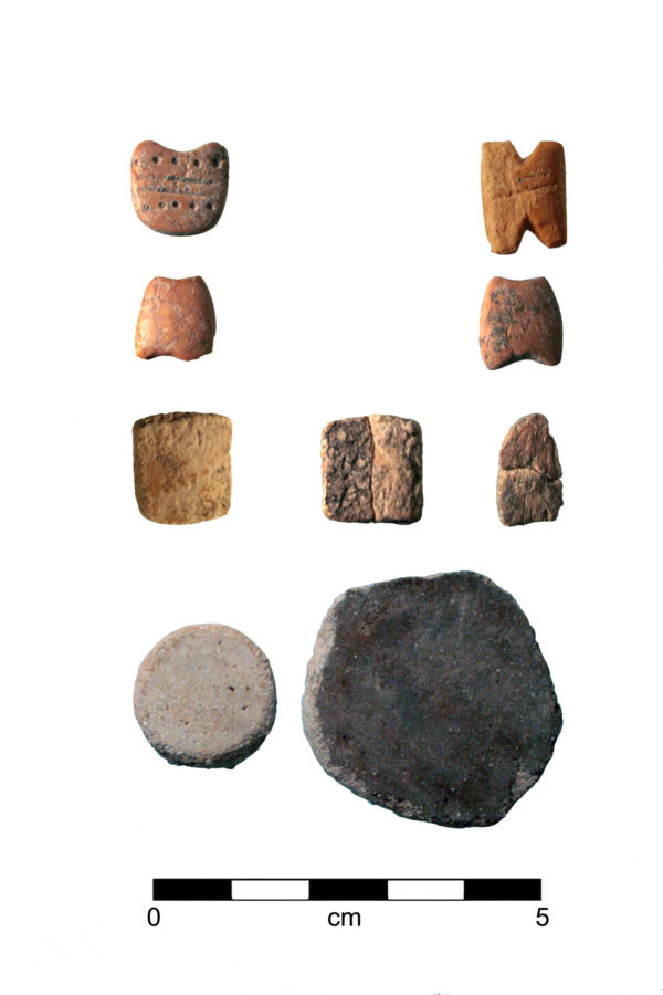 Gaming pieces from an Early Ceramic period house in Tucson. They are small pieces of bone carved into squares, circles, and more complex shapes.