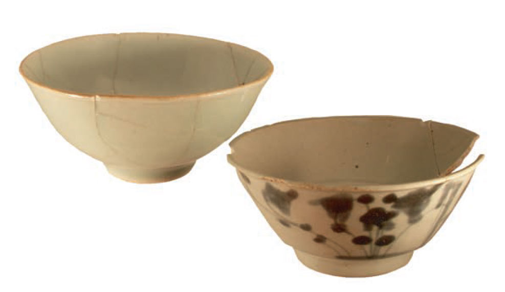 Photo of celadon rice bowls from Feature 4. One is painted with a bamboo design.